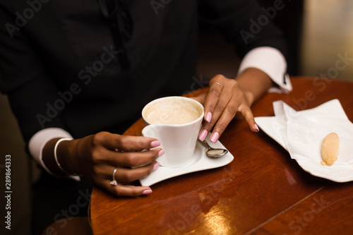 Black african american young yoman drinking coffee