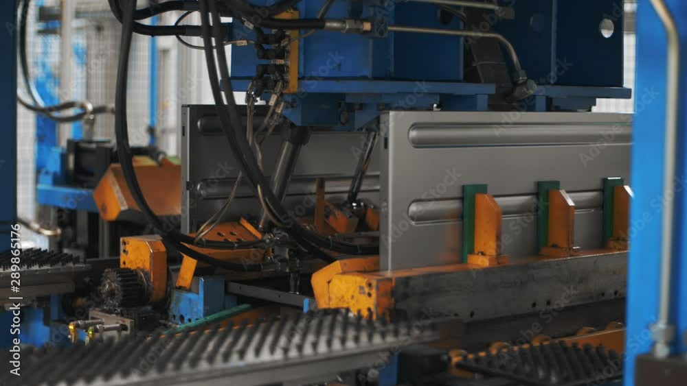 Automatic equipment assembling washing machine from metal part at plant Automatic equipment assembling washing machine from metal part at plant