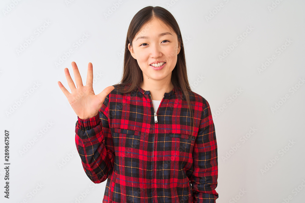 Young chinese woman wearing casual jacket standing over isolated white background showing and pointing up with fingers number five while smiling confident and happy. Young chinese woman wearing casual jacket standing over isolated white background showing and pointing up with fingers number five while smiling confident and happy.