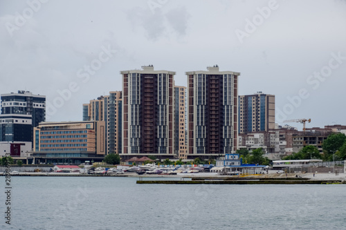 Residential multi storey buildings on the seashore. City Novorossiysk embankment of Admiral Serebryakov. photo