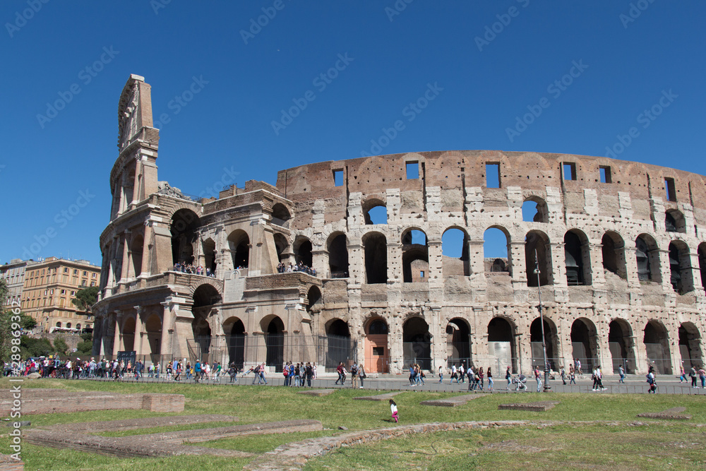 Colosseum with blue sky on background, Rome, Lazio, Italy.