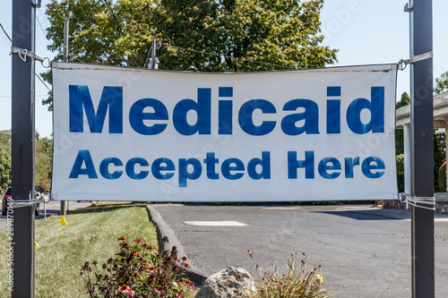 Medicaid Accepted Here sign. Medicaid is a federal and state program that helps with medical costs for people with limited income I photo