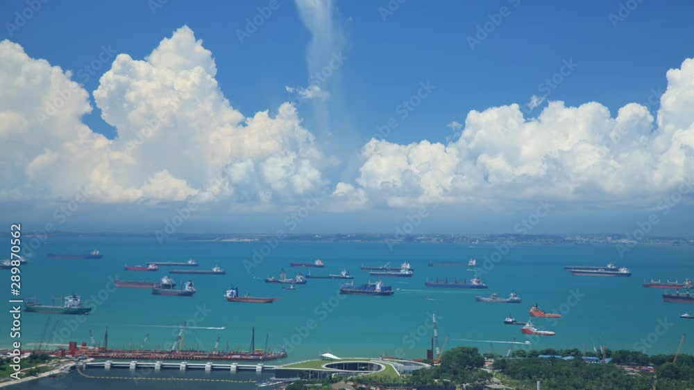 Time Lapse shot of hundreds of cargo ships anchored off the coast of Singapore. Time Lapse shot of hundreds of cargo ships anchored off the coast of Singapore.