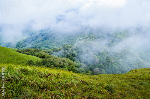 Viewpoint and green fields in the rainy season cover by fog at Doi Luang Tak, Tak Province,Thailand. © wanna