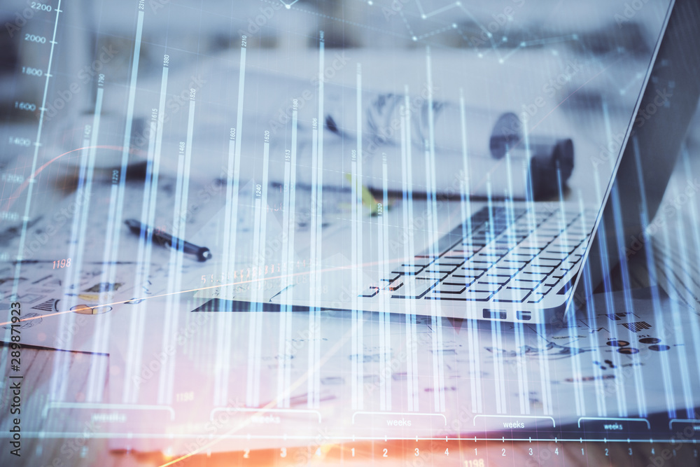 Fototapeta premium Forex Chart hologram on table with computer background. Multi exposure. Concept of financial markets.