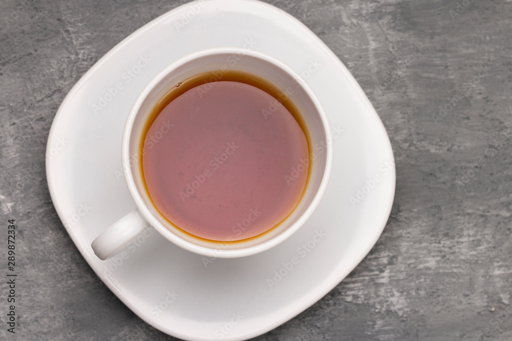 Cup of tea  on concrete stone background