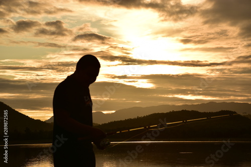 silhouette of man at sunset