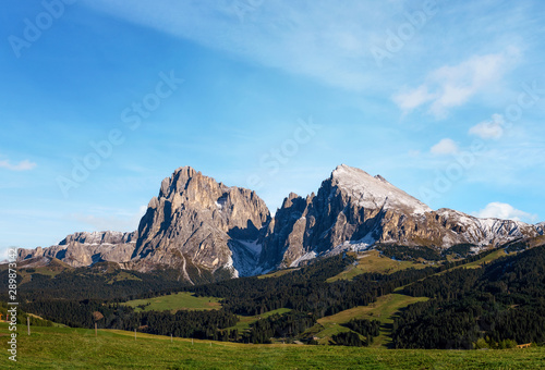 Alpe di Siusi - Seiser Alm with Sassolungo - Langkofel mountain group panorama in background at sunset