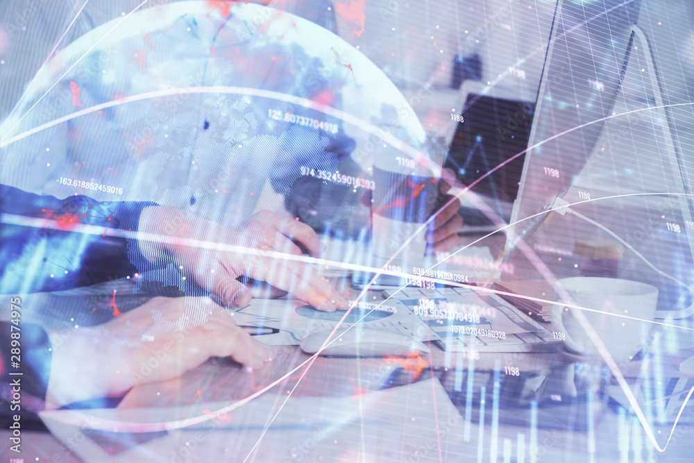 Multi exposure of chart with man typing on computer in office on background. Concept of hard work. Multi exposure of chart with man typing on computer in office on background. Concept of hard work.