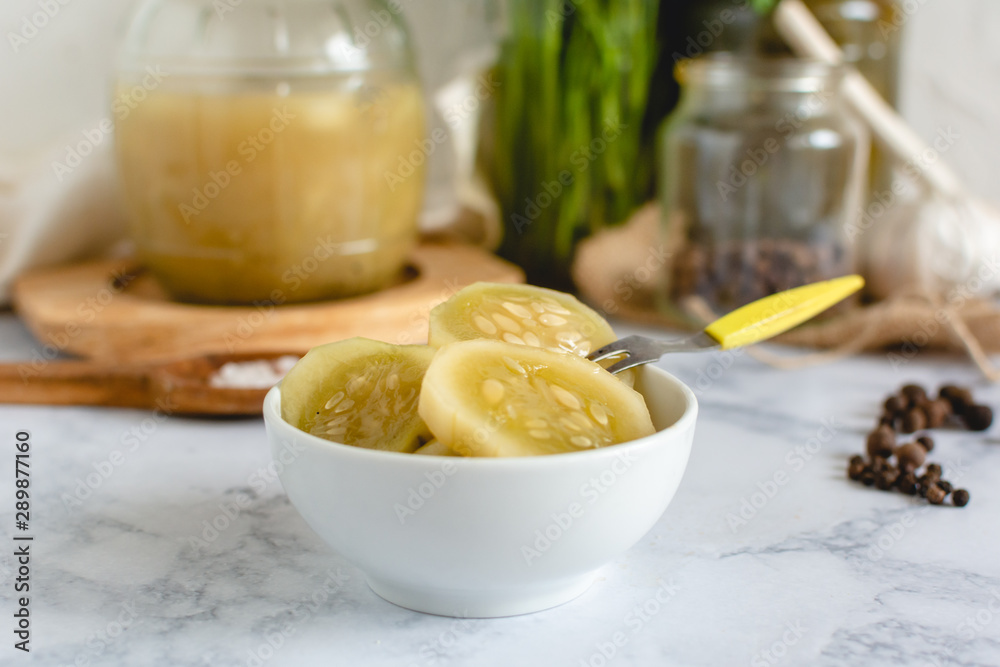 Marinated cucumber in a bowl on the kitchen table Marinated cucumber in a bowl on the kitchen table