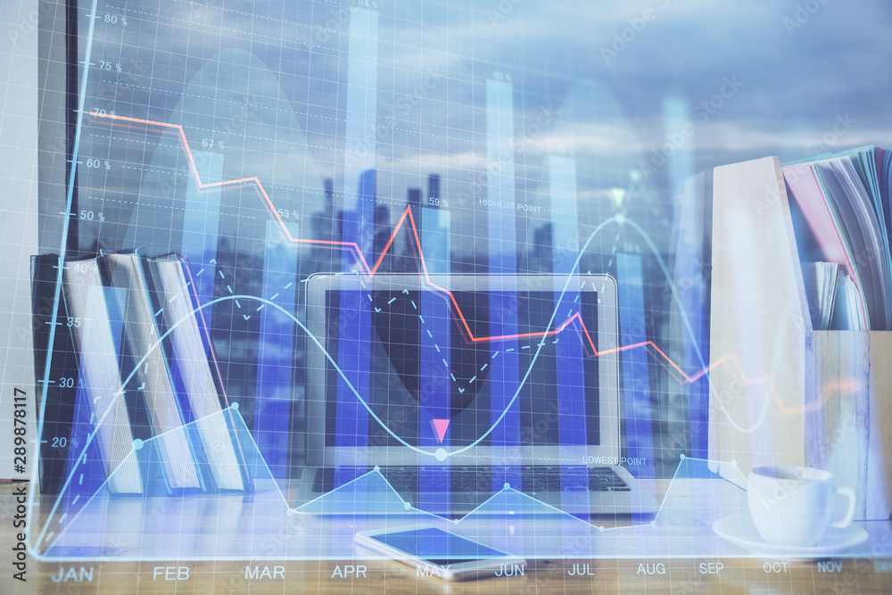 Financial chart drawing and table with computer on background. Double exposure. Concept of international markets. Financial chart drawing and table with computer on background. Double exposure. Concept of international markets.