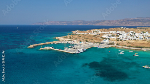 Aerial drone photo of famous sandy turquoise beach of Ammos and main port of Koufonisi island, Small Cyclades, Greece © aerial-drone