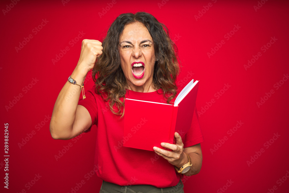 Middle age senior woman reading a book over red isolated background annoyed and frustrated shouting with anger, crazy and yelling with raised hand, anger concept Middle age senior woman reading a book over red isolated background annoyed and frustrated shouting with anger, crazy and yelling with raised hand, anger concept