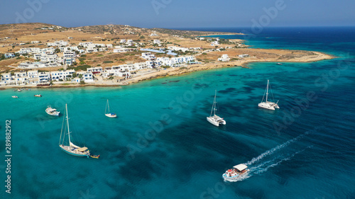 Aerial drone photo of famous sandy turquoise beach of Ammos and main port of Koufonisi island, Small Cyclades, Greece