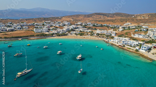 Aerial drone photo of famous sandy turquoise beach of Ammos and main port of Koufonisi island, Small Cyclades, Greece