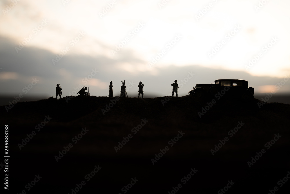 Fototapeta premium War concept. Creative composition. Silhouette of German general at the desert. Army commanders watching to the battle.