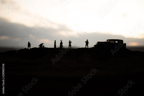 War concept. Creative composition. Silhouette of German general at the desert. Army commanders watching to the battle.