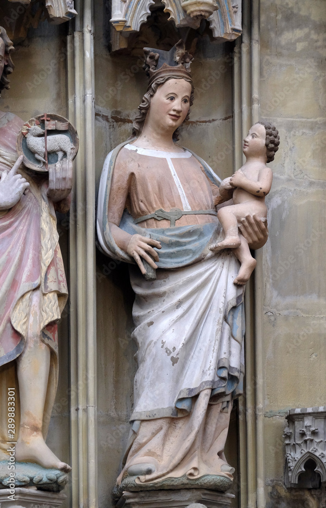 Virgin Mary with baby Jesus, statue on the tabernacle in St James Church in Rothenburg ob der Tauber, Germany