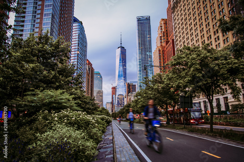 Hudson River Greenway and cyclists with One WTC view in New York City