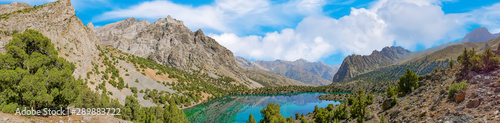 Panoramic view of Alaudin lake with turquoise water on a rocky mountain background. Fann Mountains,Tajikistan, Central Asia