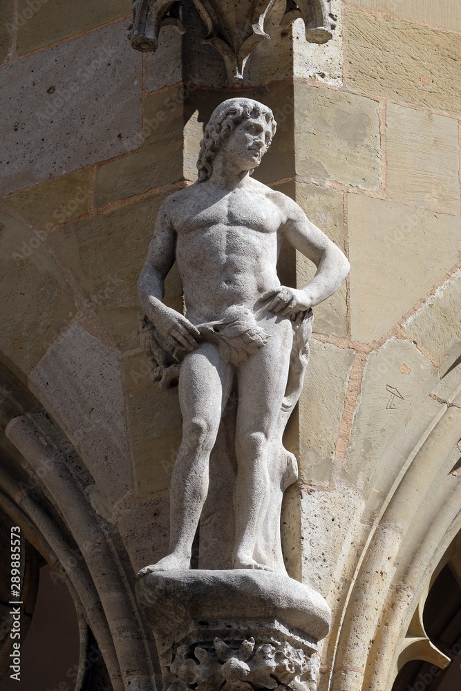 Obraz premium Adam, statue on facade of the St James Church in Rothenburg ob der Tauber, Germany