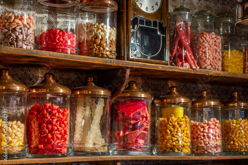 Old candy store. Colorful candies in jars. Old fashioned retro style