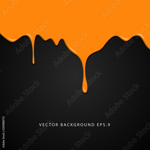 Wet orange paint on black background