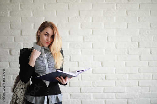 Young pretty blonde girl student © alexkich