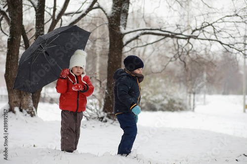Fototapeta Naklejka Na Ścianę i Meble -  Children in winter park play