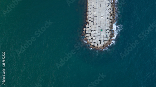 drone photo of rocks on the sea water