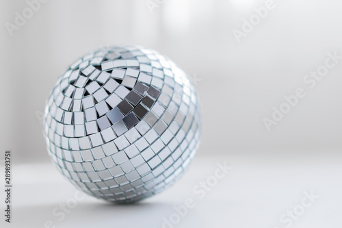 disco ball on a light background with a shadow