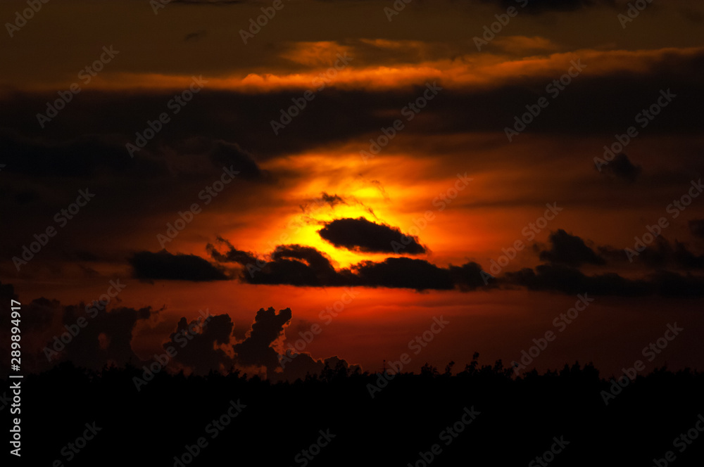 clouds silhouette on sunset background