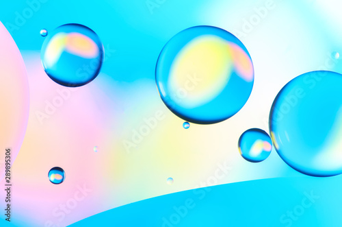 Colorful abstract images of oil drops on water. Colored circles and waves as a concept of scientific discovery, space or molecular research. © Александр Кузьмин