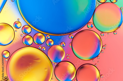 Colorful abstract images of oil drops on water. Colored circles and waves as a concept of scientific discovery, space or molecular research.