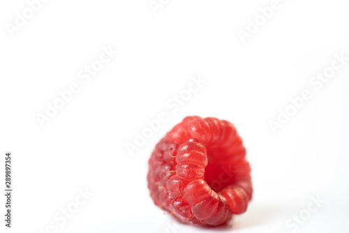 Fresh raspberries on a white background