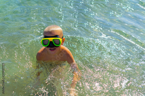 Boy enjoying masked swimming in the sea
