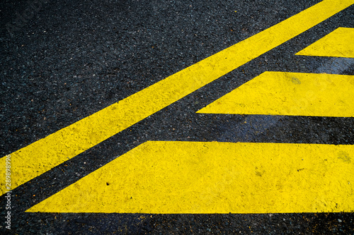 Yellow road signage in reflective paint, abstract elements for design. © Daguimagery