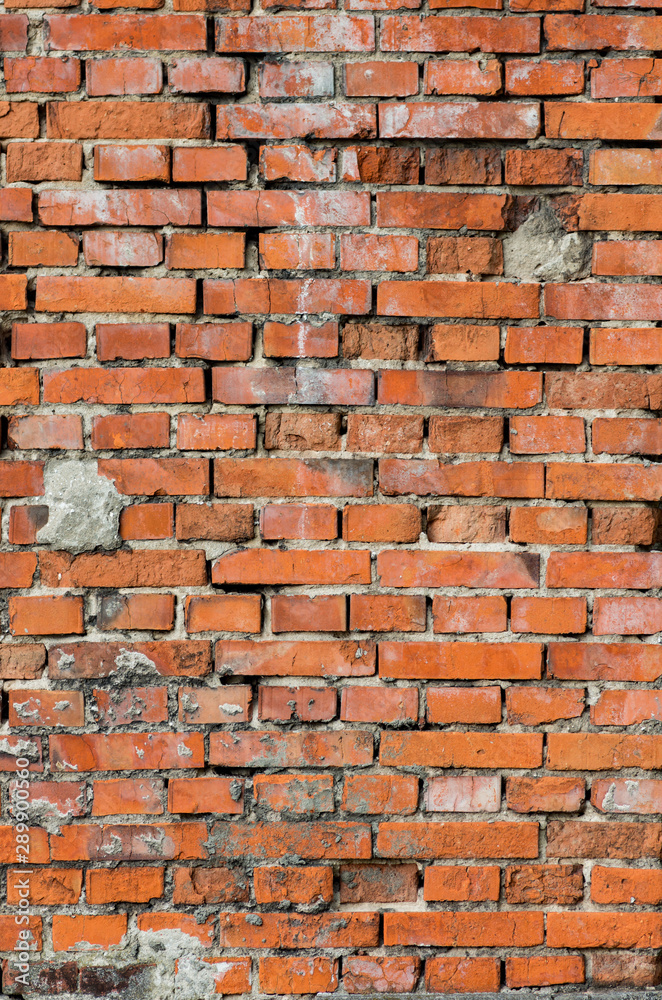 Fototapeta premium weathered red brick wall background