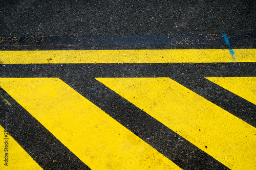 Bold yellow bands, reflective street signage abstract elements. © Daguimagery