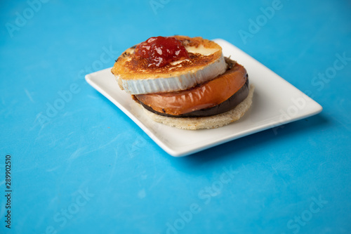 Goat cheese with mushroom and tomato, typical Spanish tapa