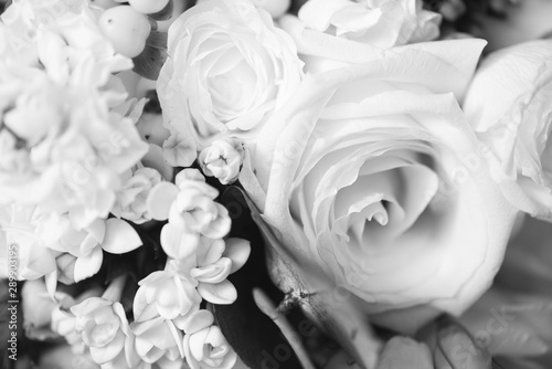 Beautiful bouquet of flowers closeup. Themes of engagement, declaration of love, wedding day, florist services. Monochrome effect