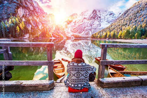 Obraz na płótnie Amazing fascinating magical autumn winter landscape with a girl playing guitar over a lake on Fanes-Sennes-Braies in the Dolomites Alps. (meditation, relaxation, stress relief, harmony - concept) w salonie