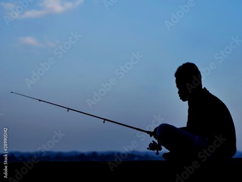 Little Boy Fishing In the River