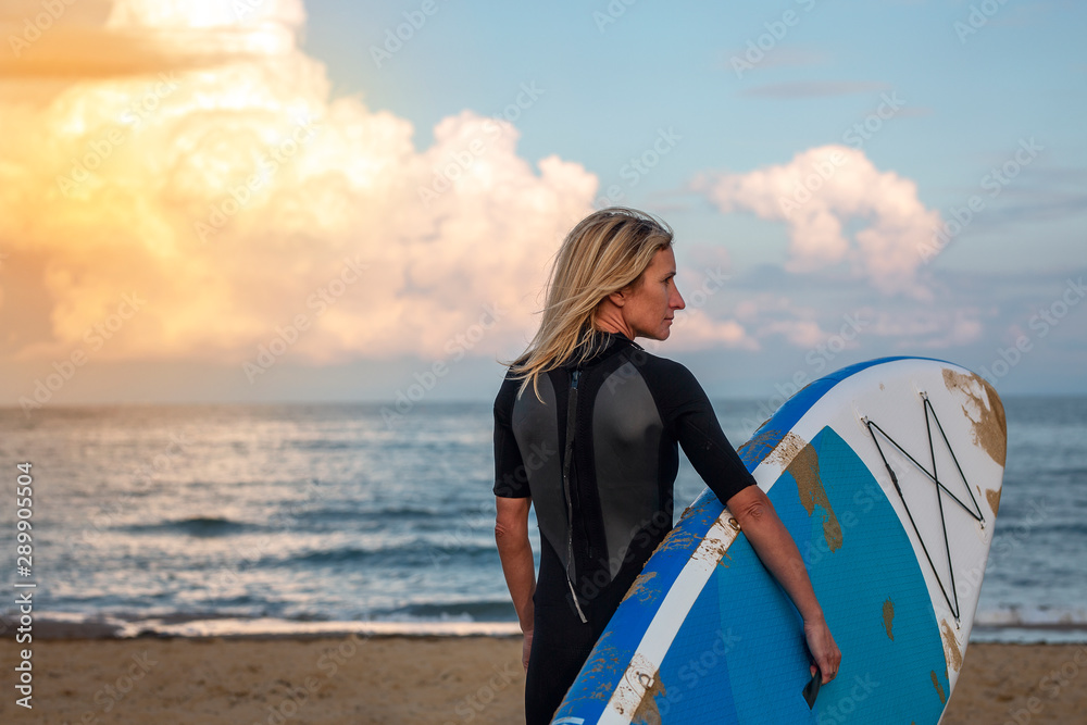 Fototapeta premium Active woman with surf board.