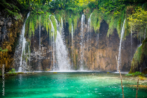Amazing waterfalls with crystal clear water in the forest in Plitvice lakes National Park  Croatia. Nature landscape