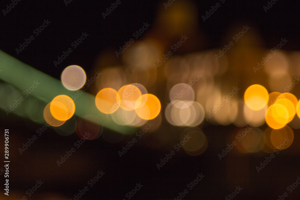 Fototapeta premium blurry lights of a big city at night. Background for travel photos. bokeh advertising poster
