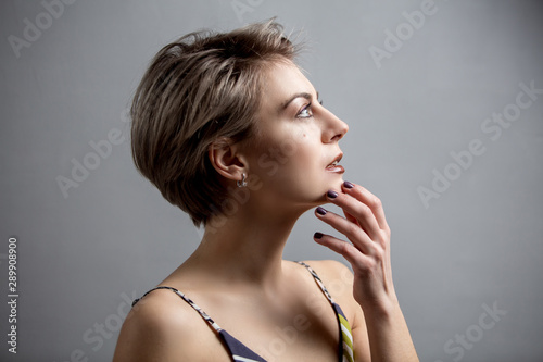 Portrait of a beautiful woman with short hair studio shot