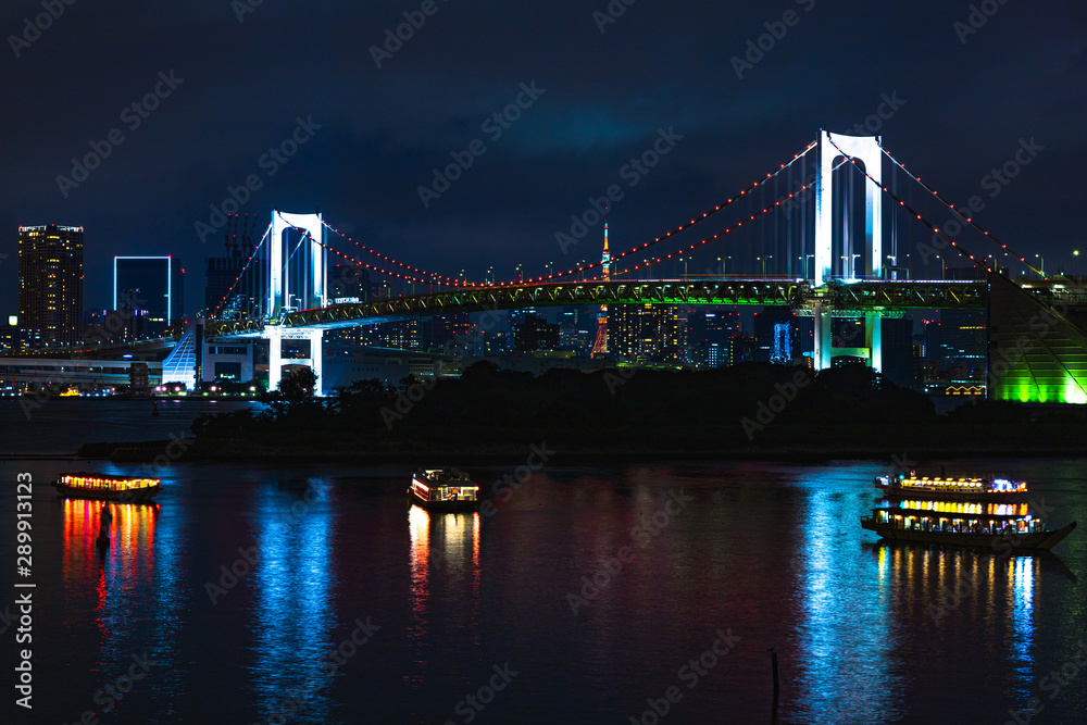 Night time shot of Rainbow Bridge and the skyline of Tokyo