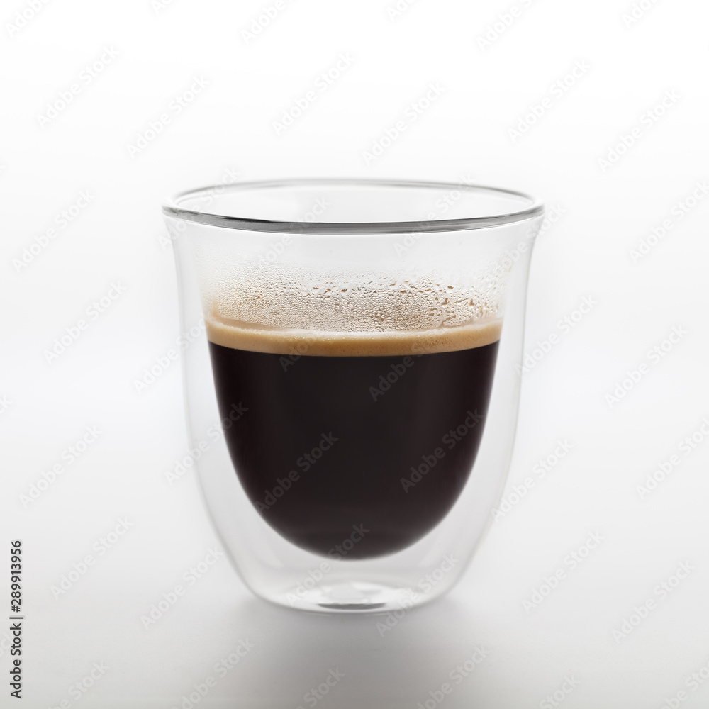 The glass of coffee isolated on white background. Top view at an angle. For design.