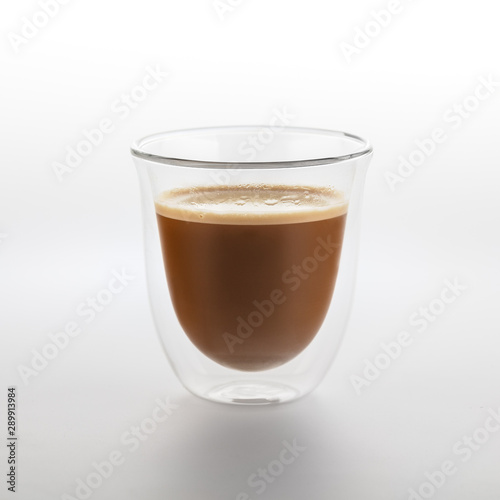 The glass of coffee isolated on white background. Top view at an angle. For design.